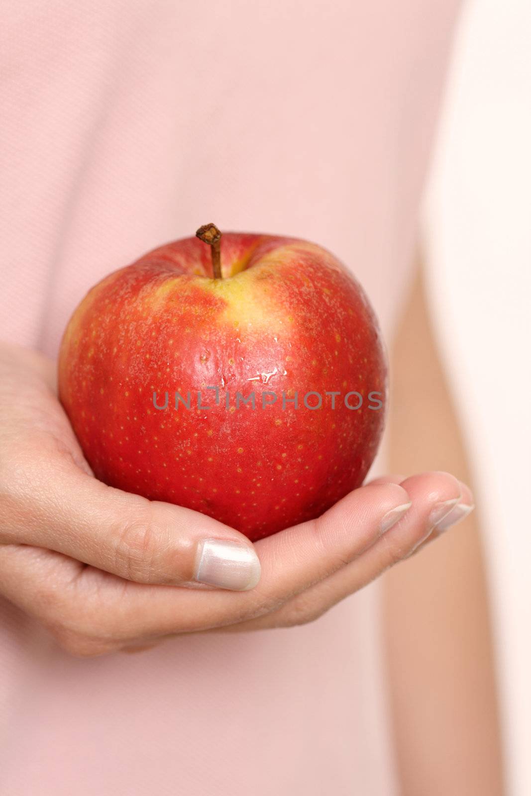 A woman holding an apple