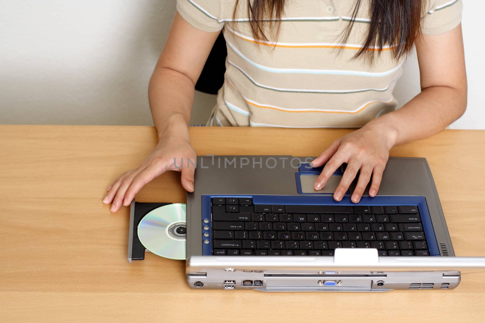 Businesswoman and laptop by aremafoto