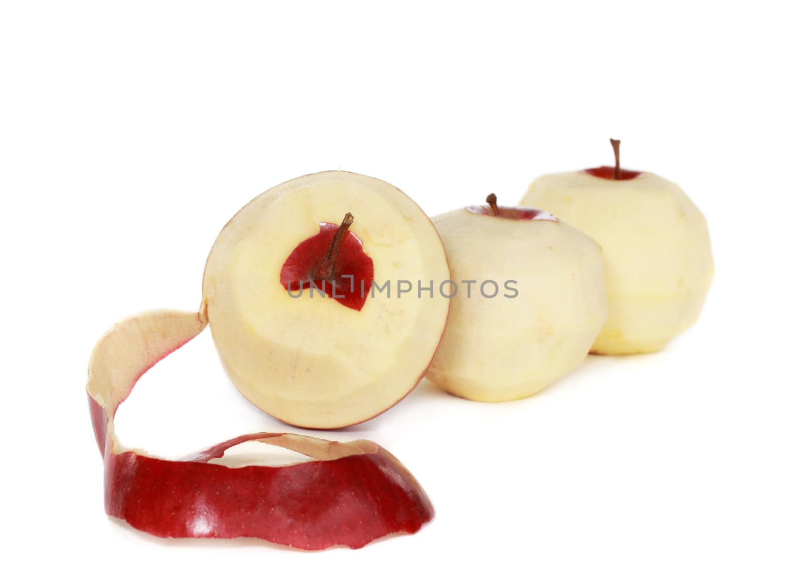 three peeled red fresh apple, isolated on white