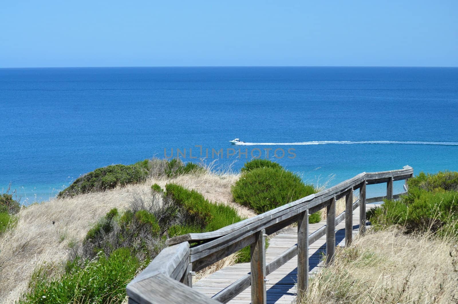 Beautiful azure, blue water coast shore with footpath. Hallett Cove Conservation Park, South Australia.