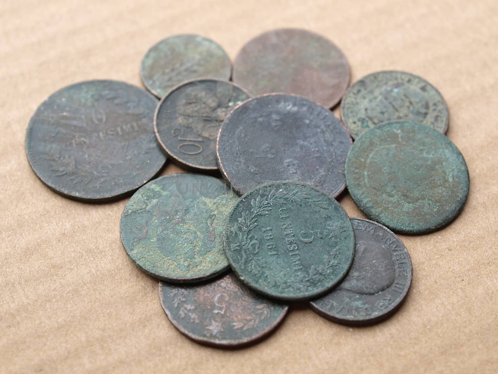 A heap of many ancient rusted coins