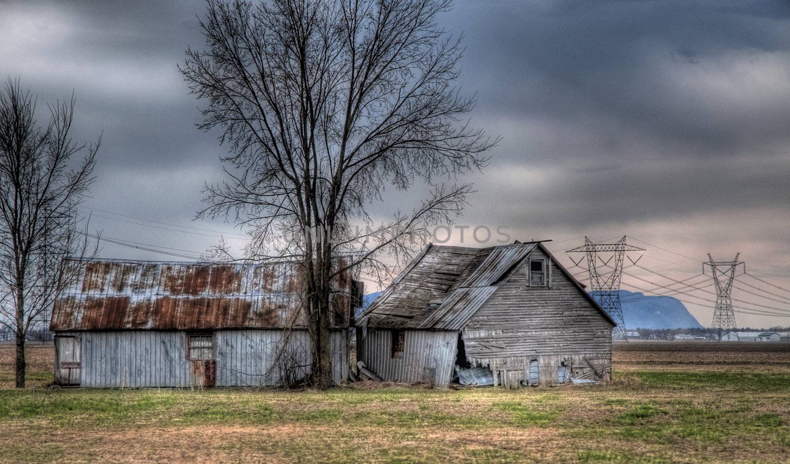 an hdr photo treatment on a old barn isolated in a field