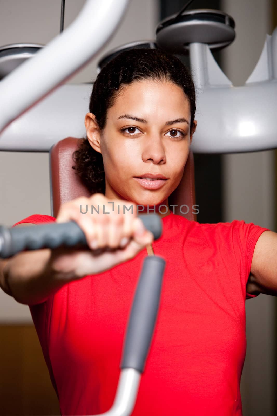Beautiful girl working out at the gym by Fotosmurf