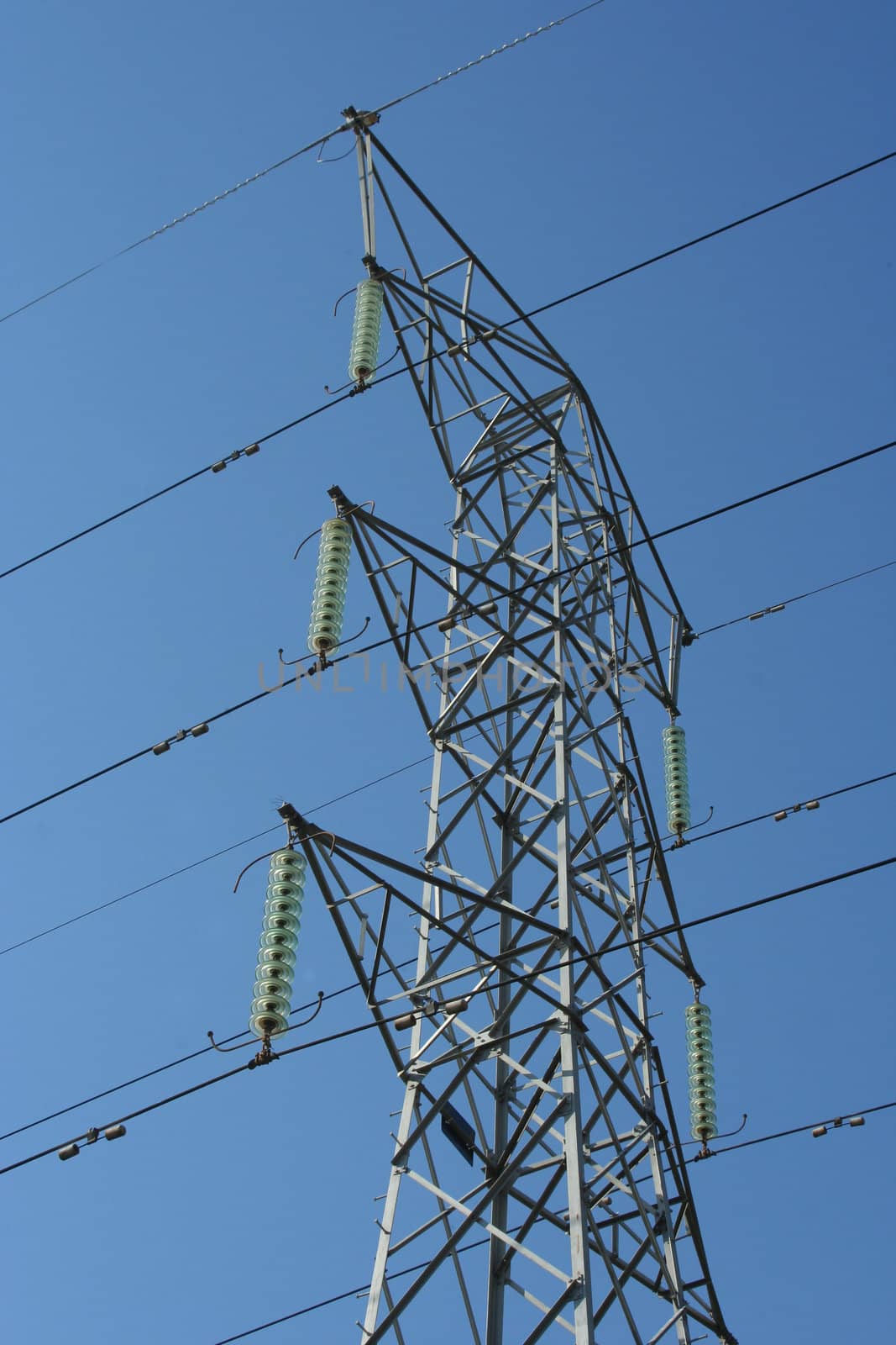 Tower with electrical cables in the sky.