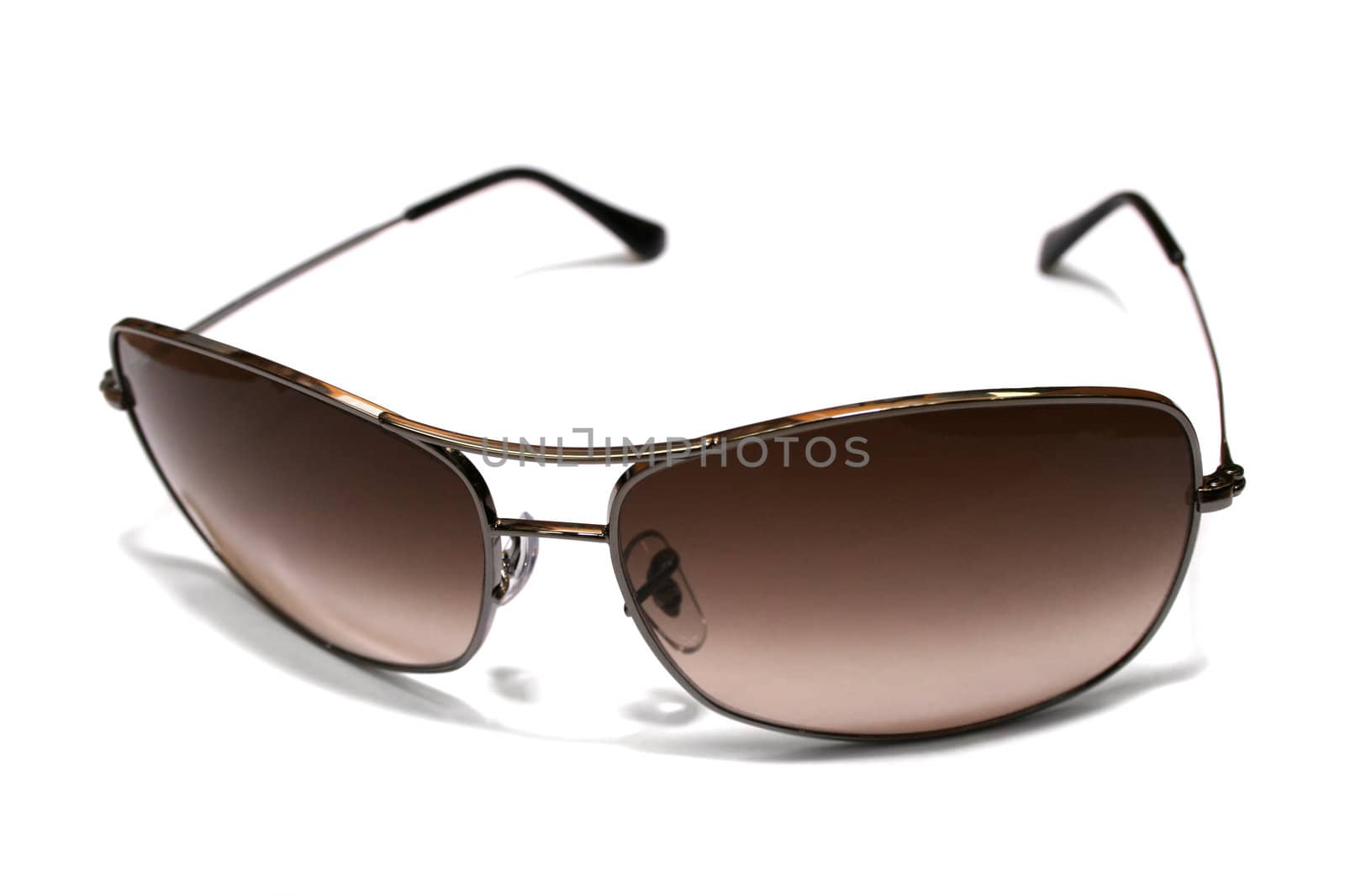 Sun glasses in a metal frame on a white background