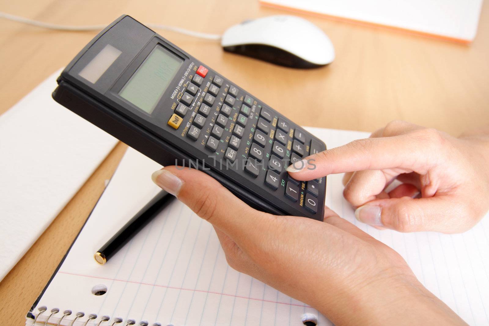 A woman uses a calculator