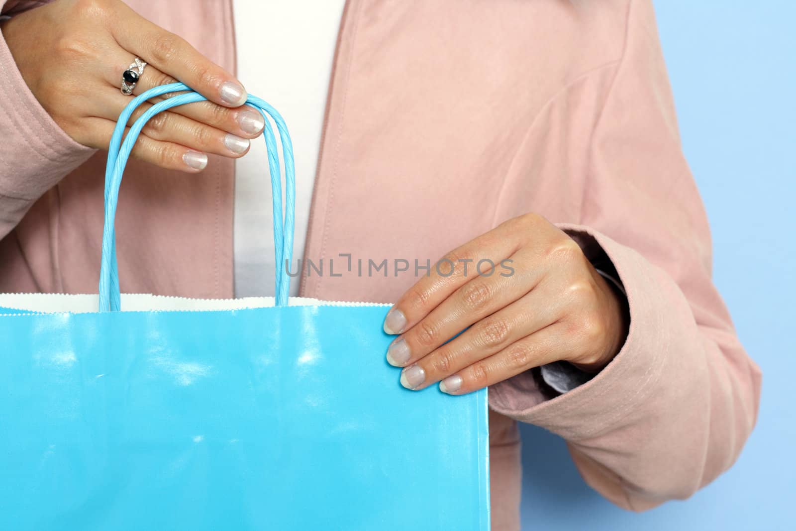 A woman carrying a shopping bag