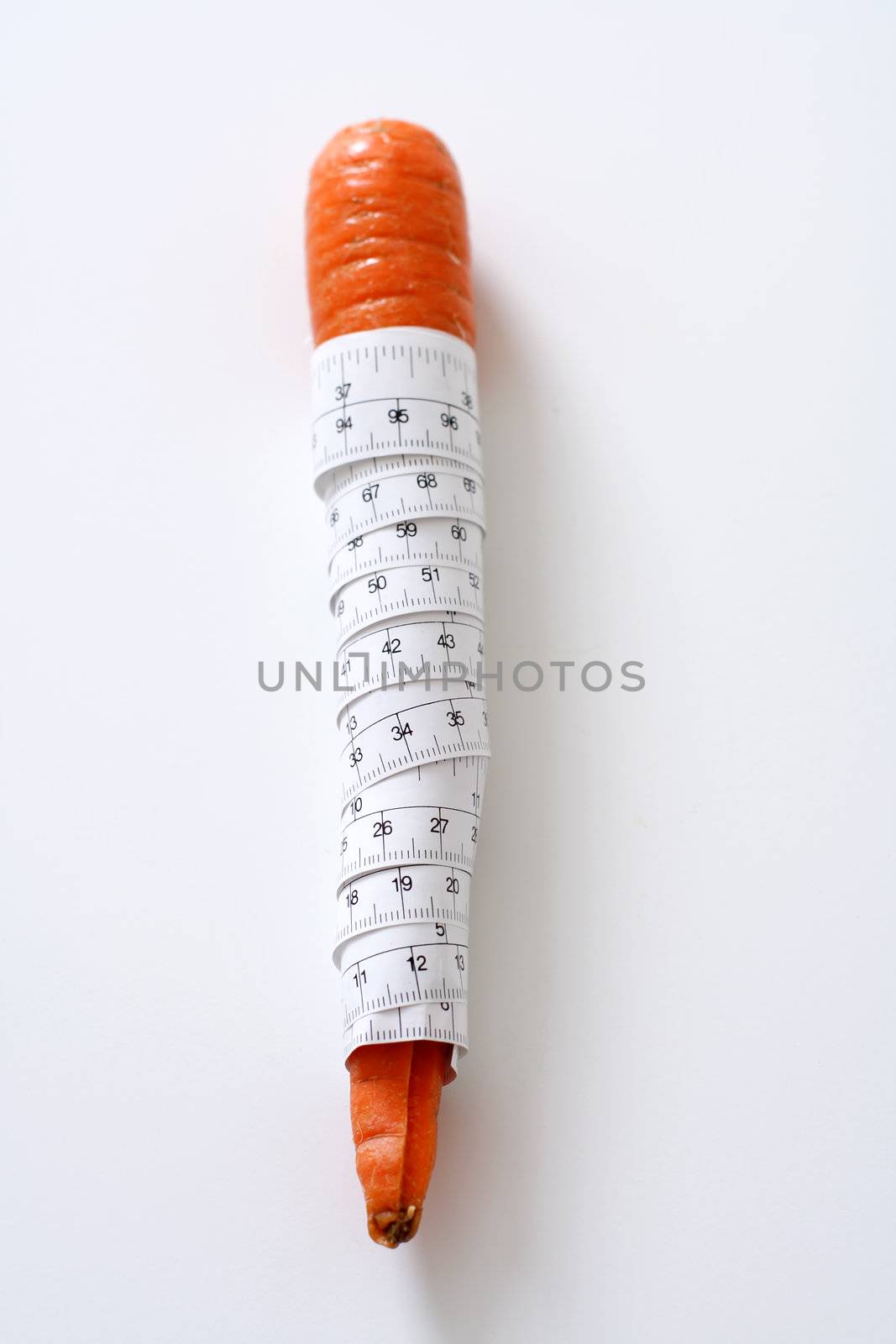 Carrot wrapped in measuring tape