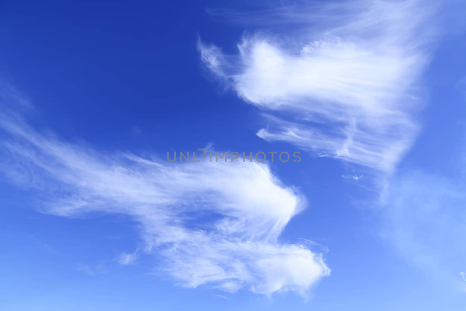 White clouds against blue sky