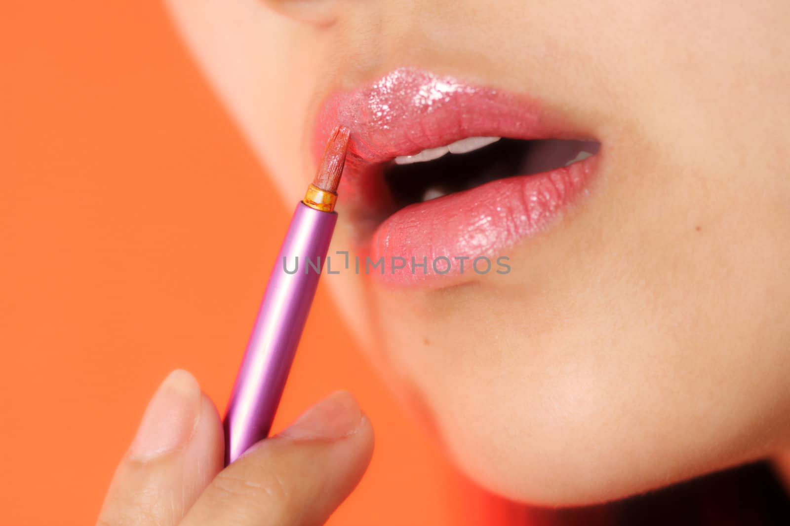 A woman applying make-up/cosmetics