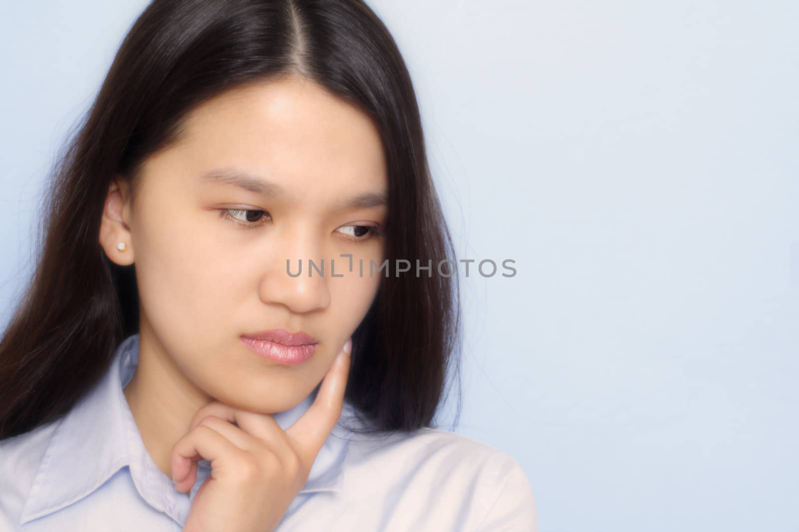 A stressed businesswoman with worried look