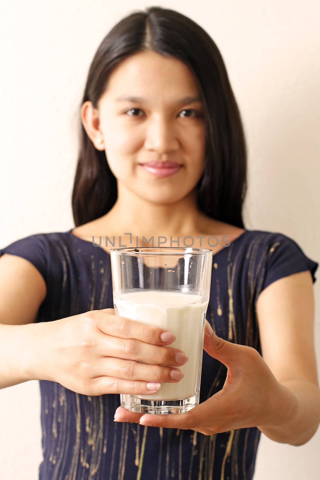 A woman with a glass of milk