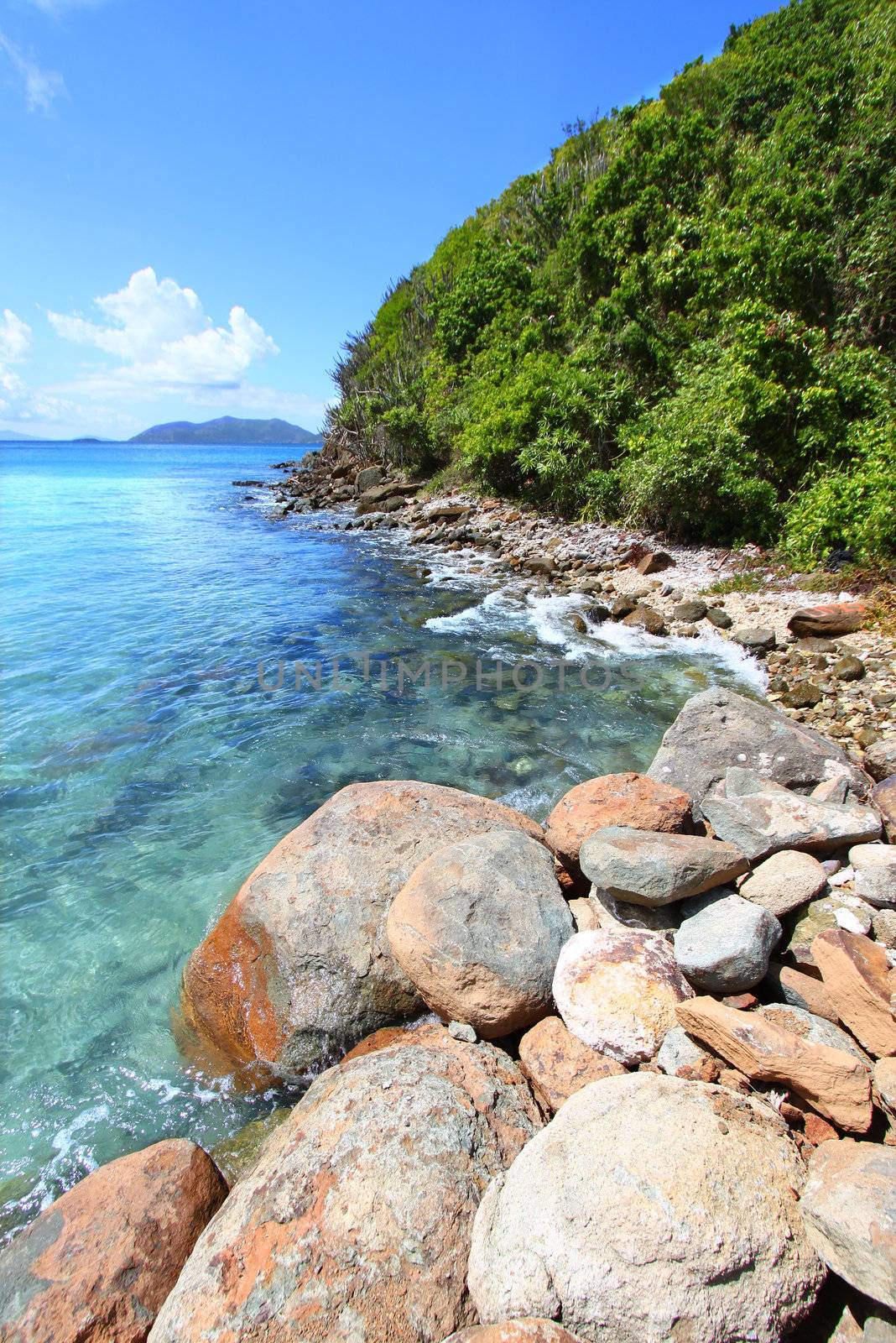 A rugged rocky coastline along beautiful Brewers Bay of Tortola - BVI.