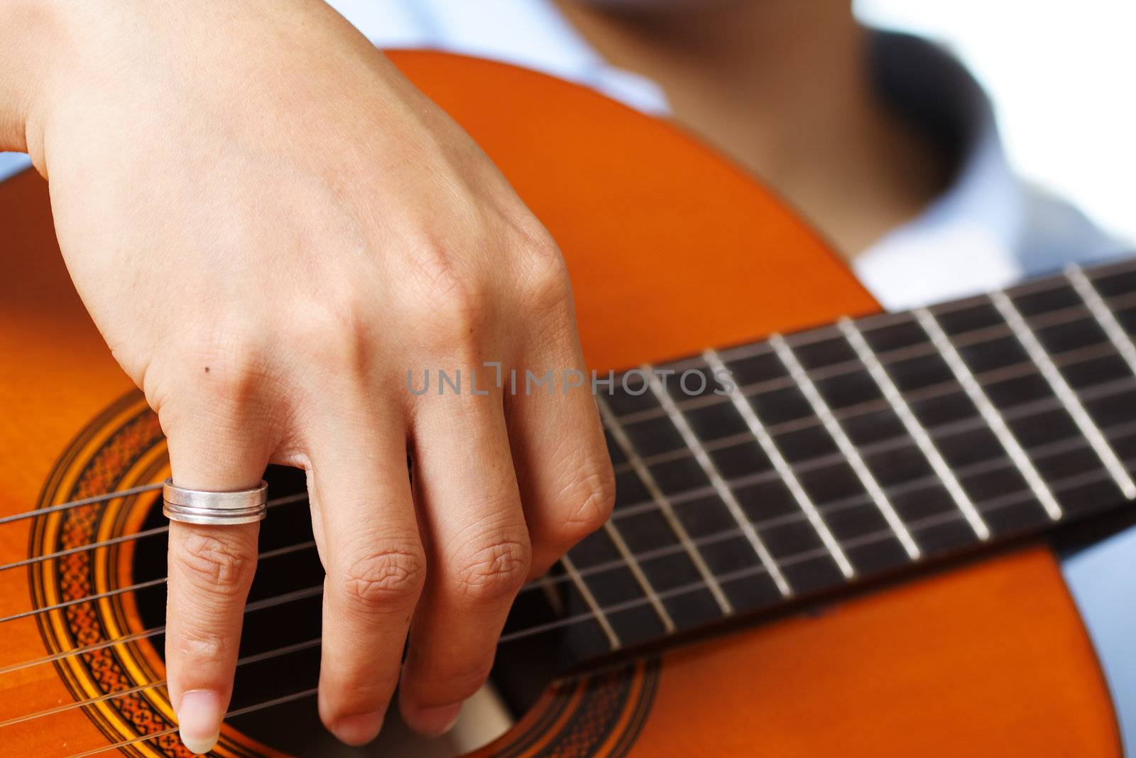 A guitar player strumming his guitar