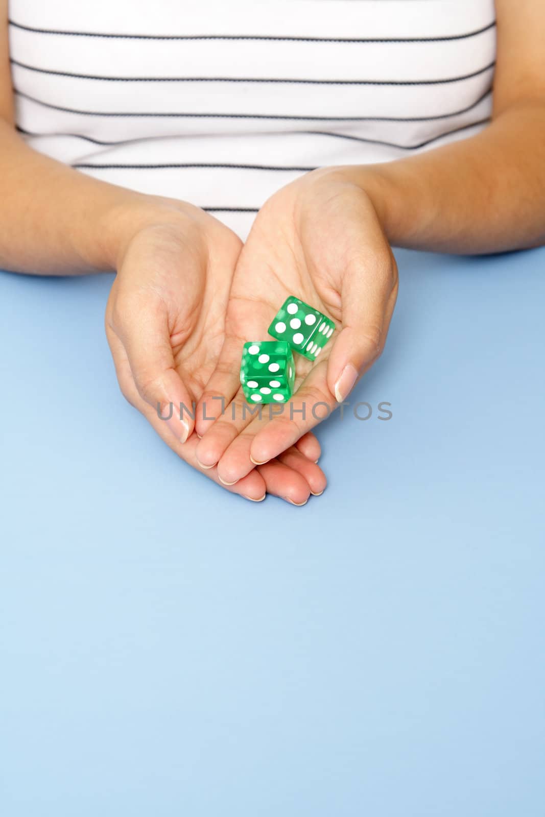 A woman holding dice