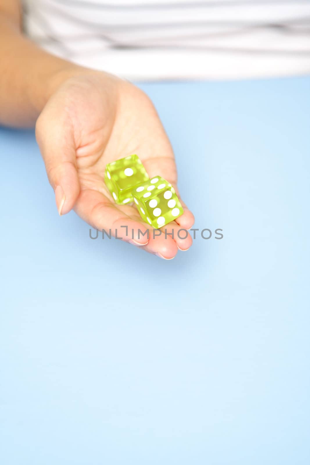 A woman holding a dice