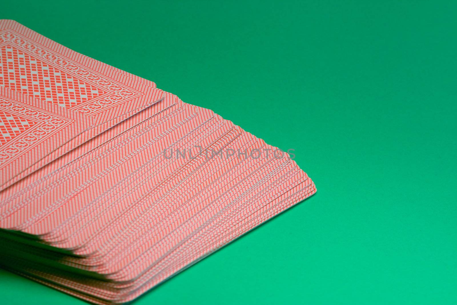 Deck of cards on green table