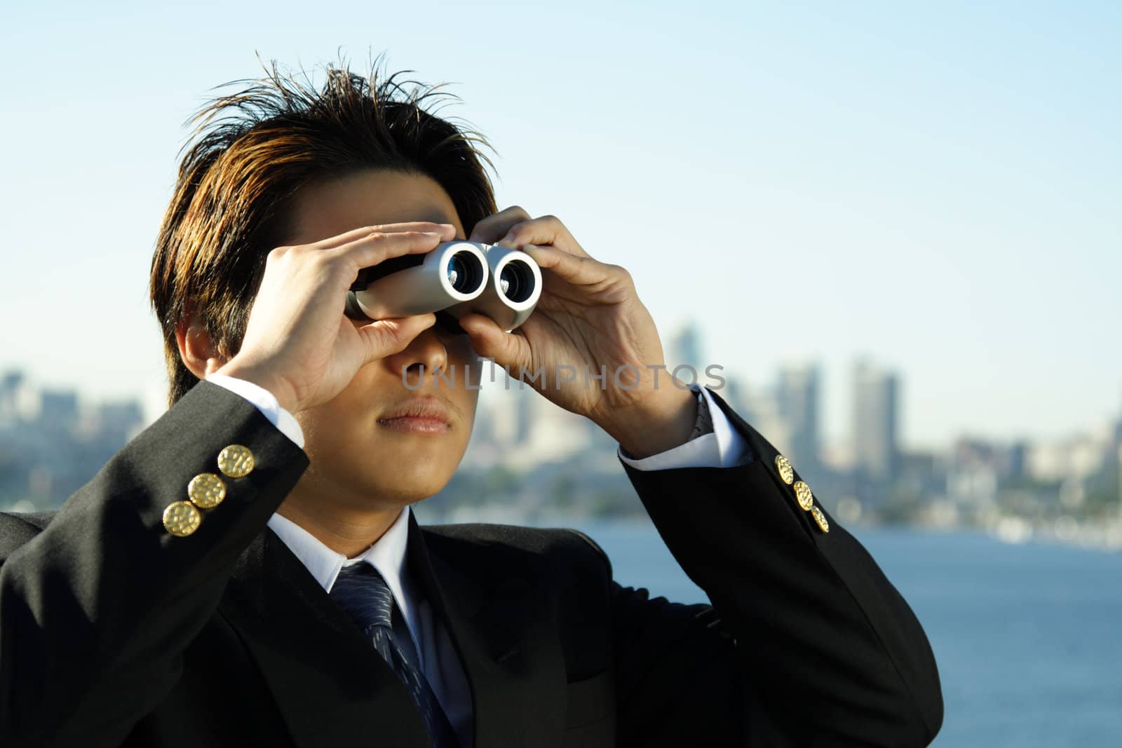 Businessman with binoculars, can be used for business vision/prospect metaphor