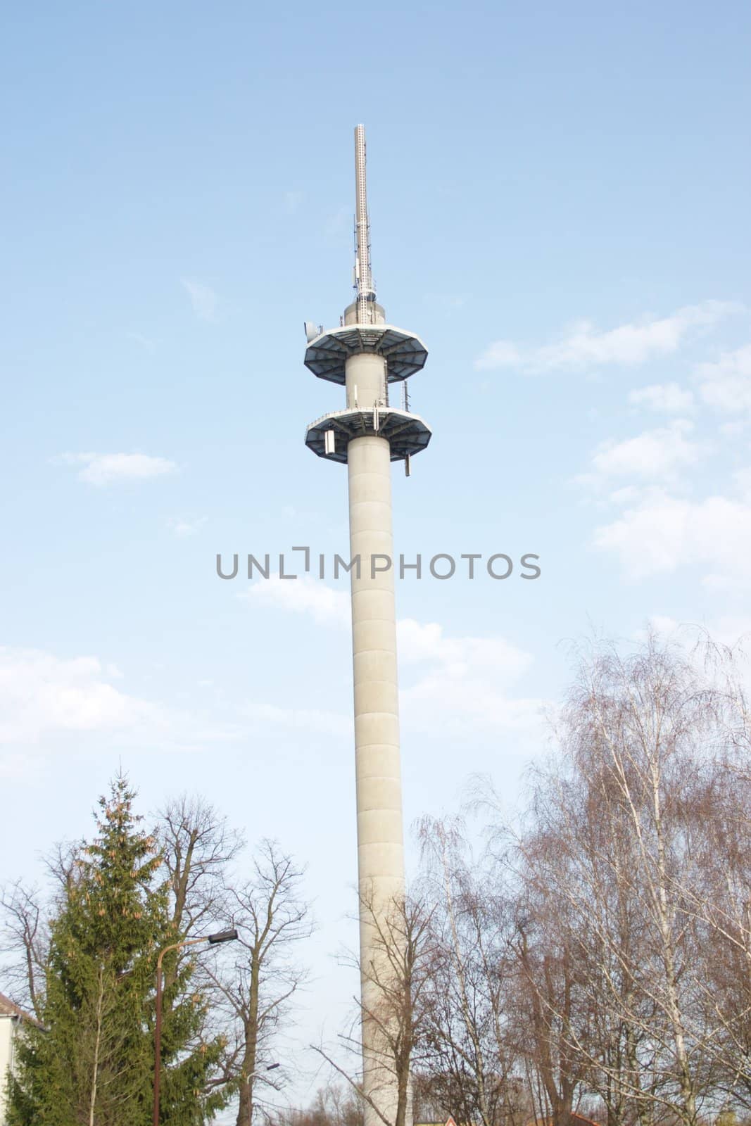 Radio tower under the dark blue sky, in city Nauen, Germany
