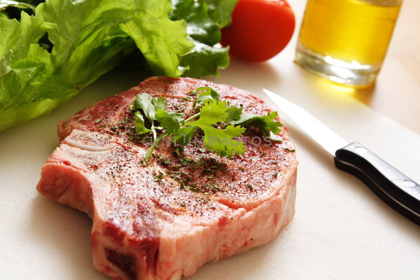 Ribeye steak being prepared for cooking