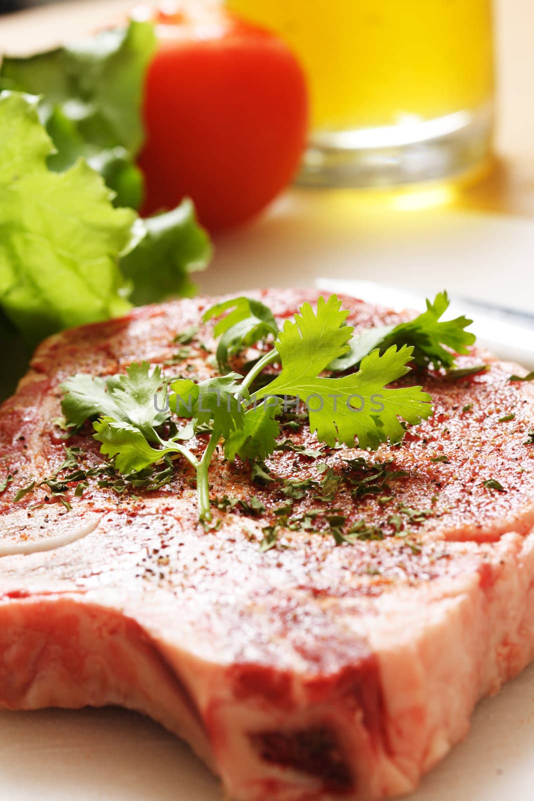 Seasoned ribeye steak ready for cooking