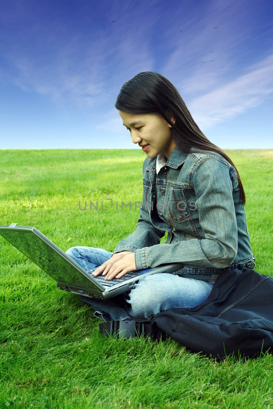 A girl with laptop working outdoor