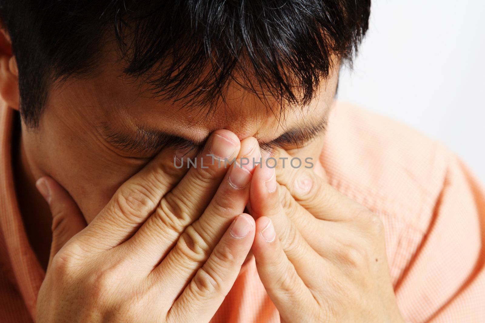 Stressed out businessman having a headache