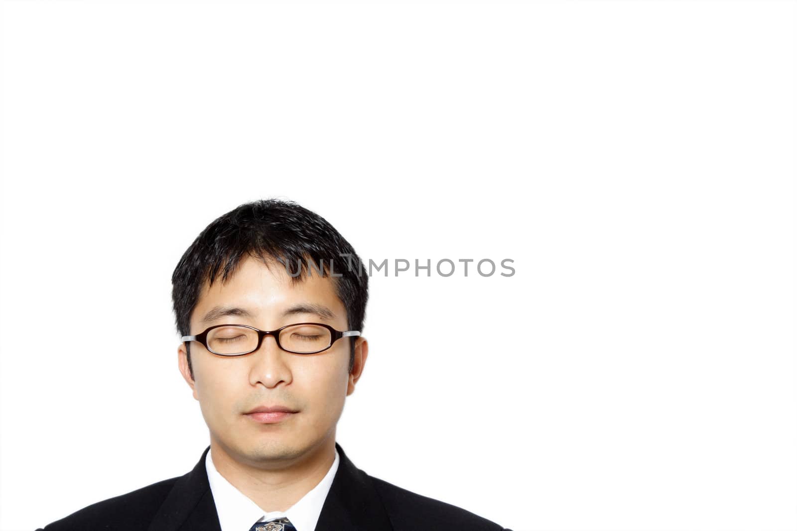 Businessman with his eyes closed