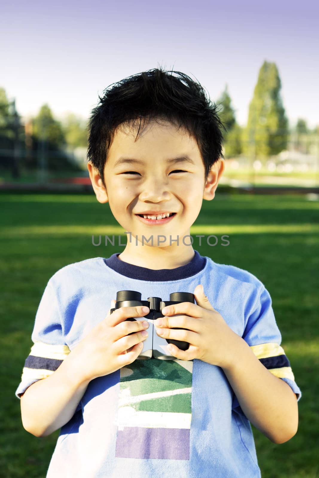 A boy having fun with binoculars