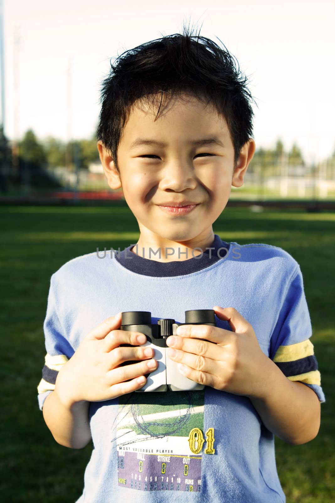 A boy having fun with binoculars