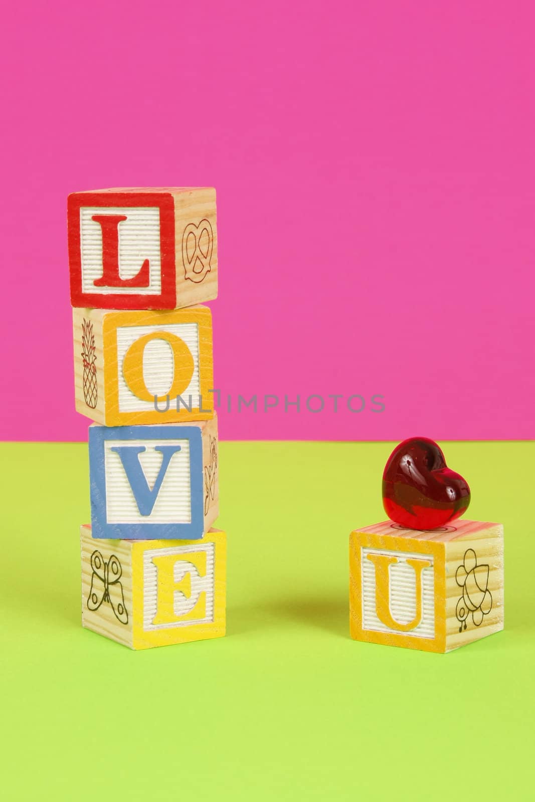 Childrens blocks spell the words love you with bright colors.