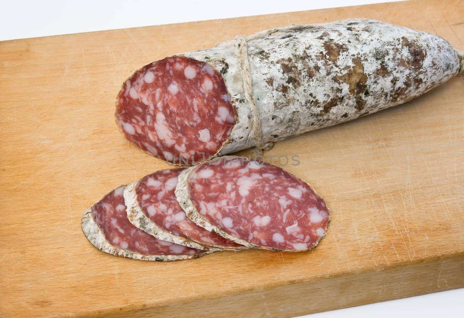 salami sliced on cutting board