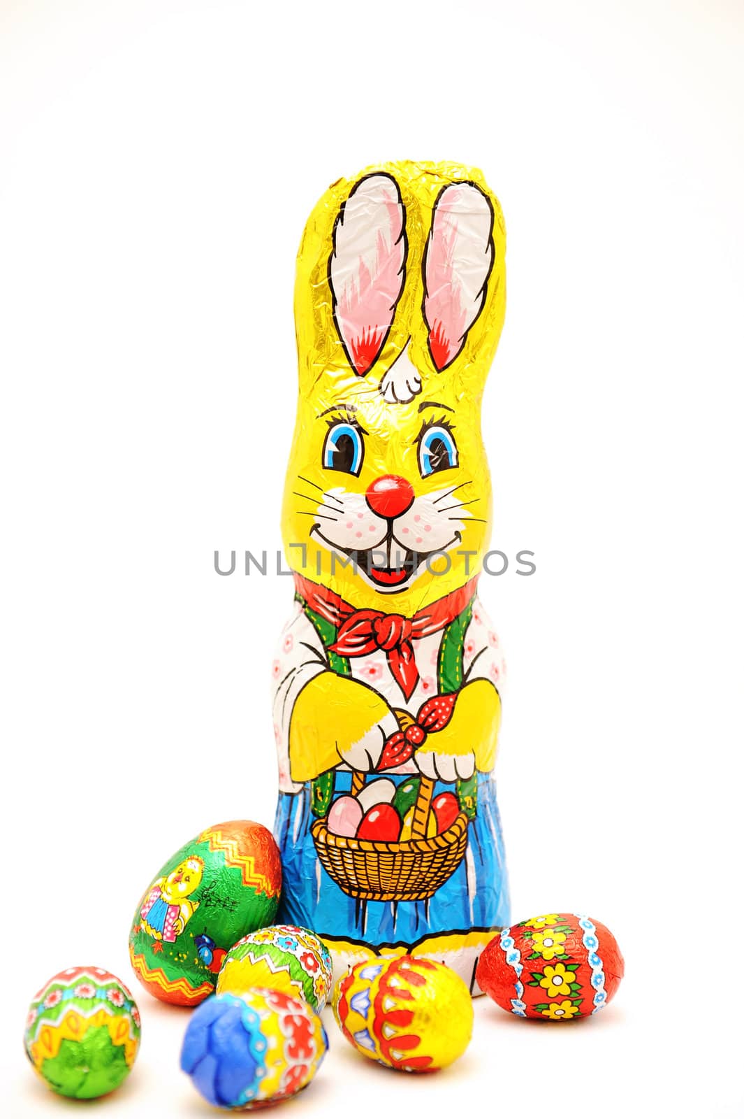 Multicoloured wrapped chocolate Easter bunny and eggs