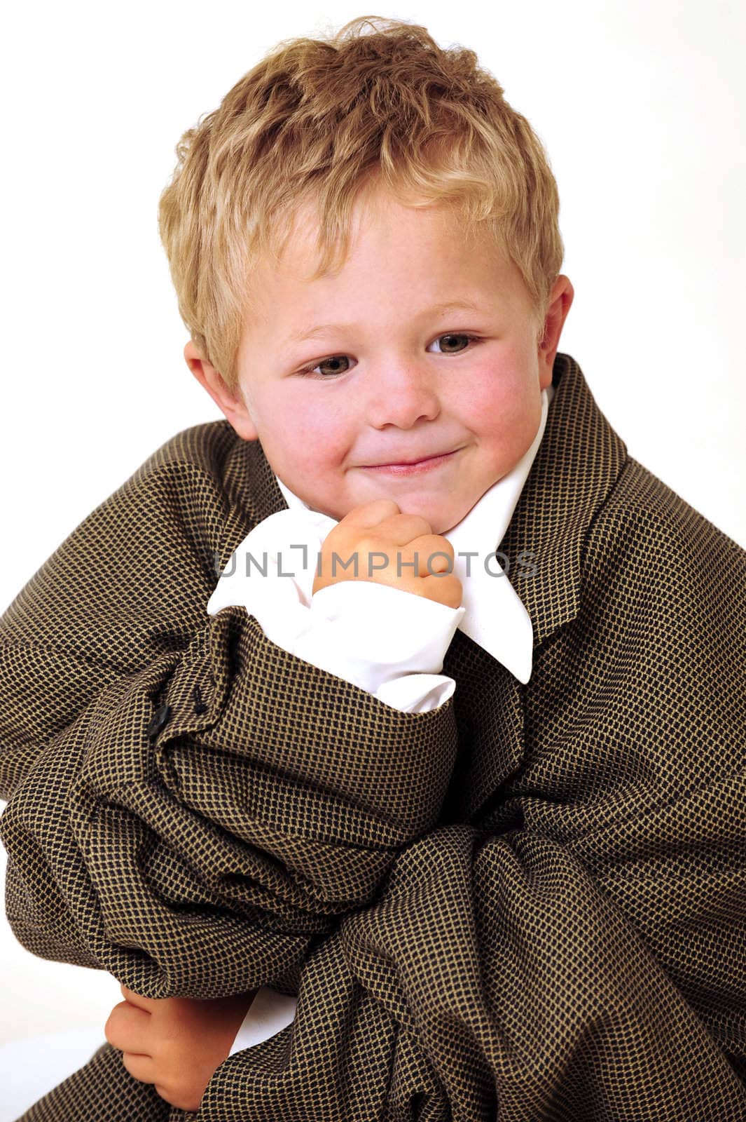 Blond young Boy in oversized business clothes in thinking position