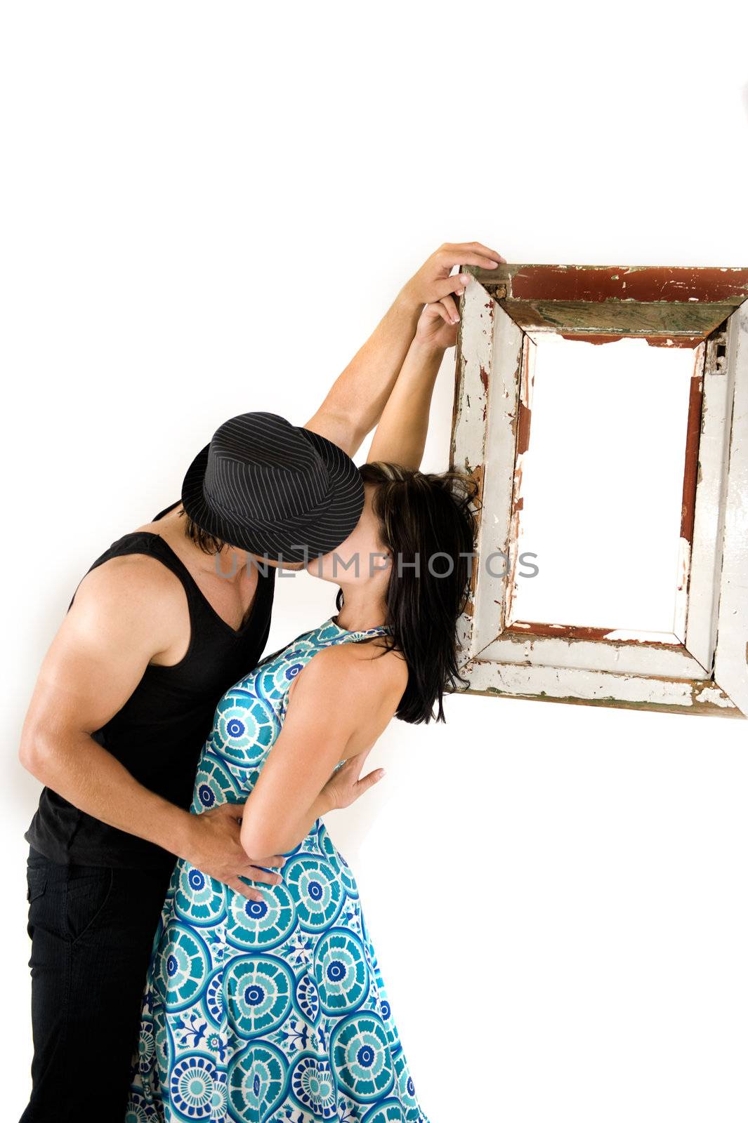 Couple kissing against a suspended frame by Ansunette