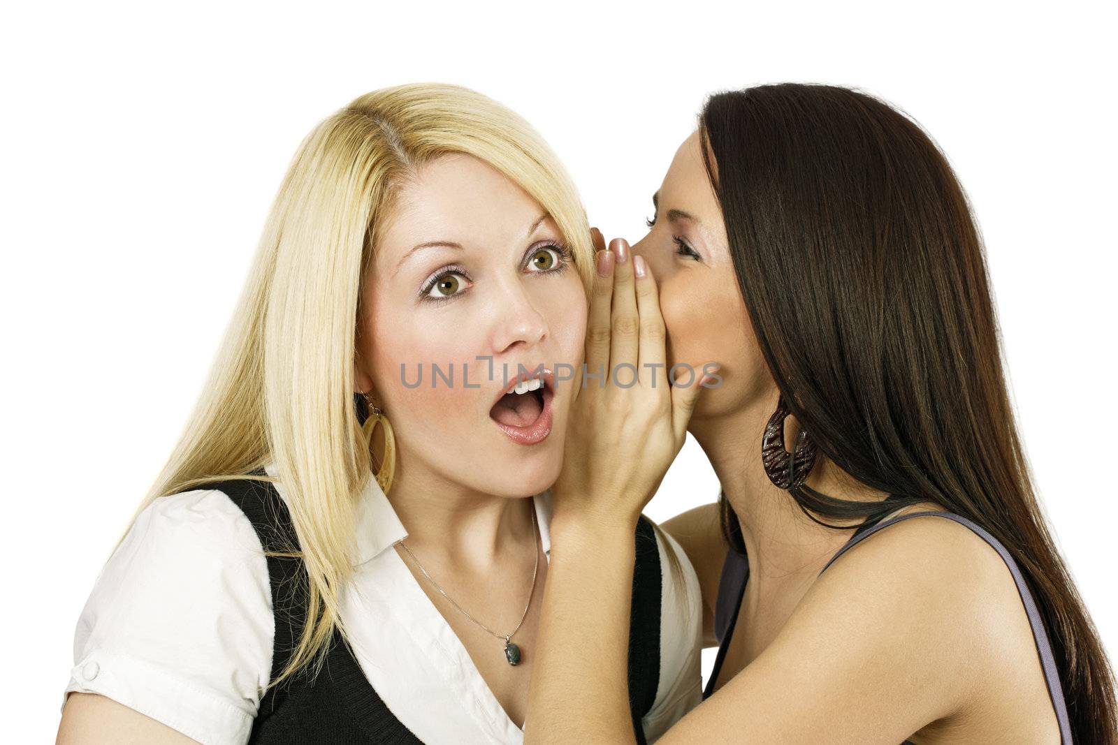 Two women whispering secrets by sumners