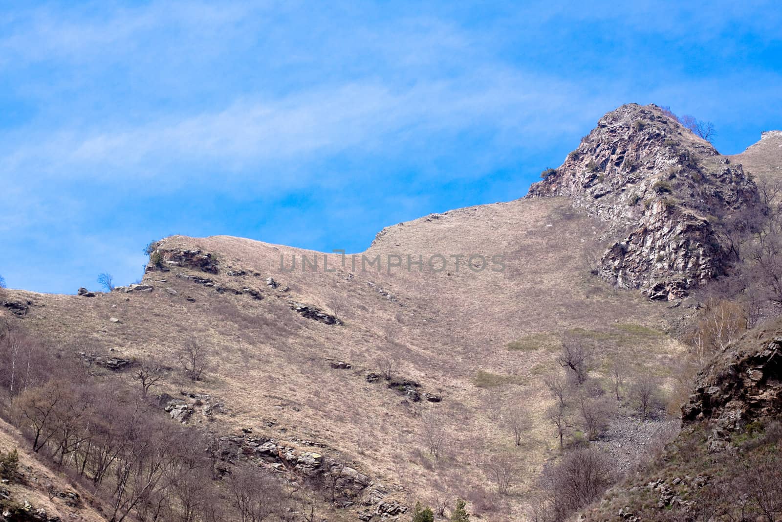 Caucasus mauntains: ridge; rocks and blue sky 
