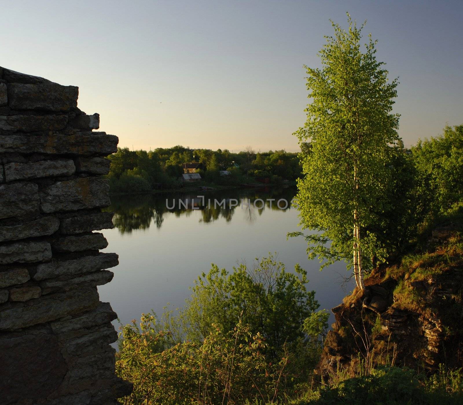 View on the river Volkhov. In the summer, early in the morning, a view on the river Volkhov from coast at an old fortress.