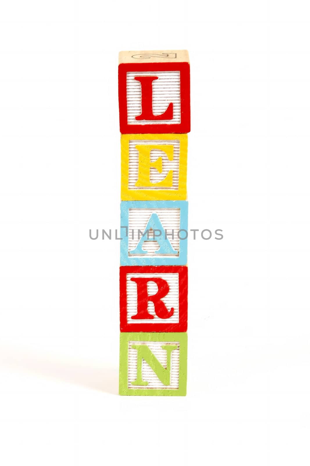 Childrens colorful blocks spell the word learn.