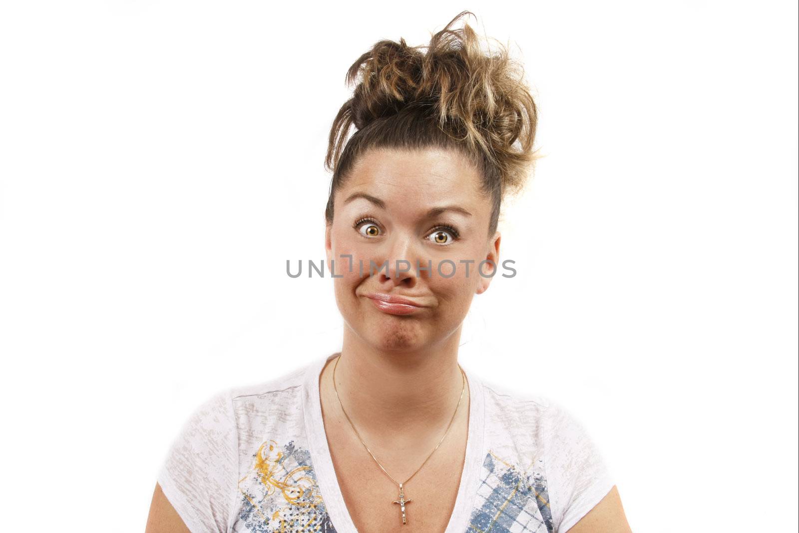 Middle aged young woman ahainst a white background making a crazy funny face.