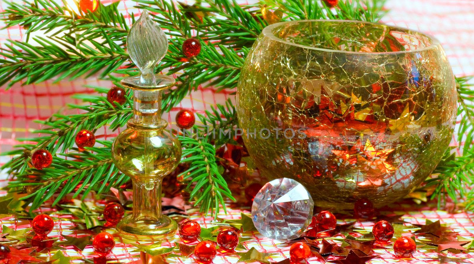 Christmas composition with  bottle,  crystal, stars  and branch of spruce