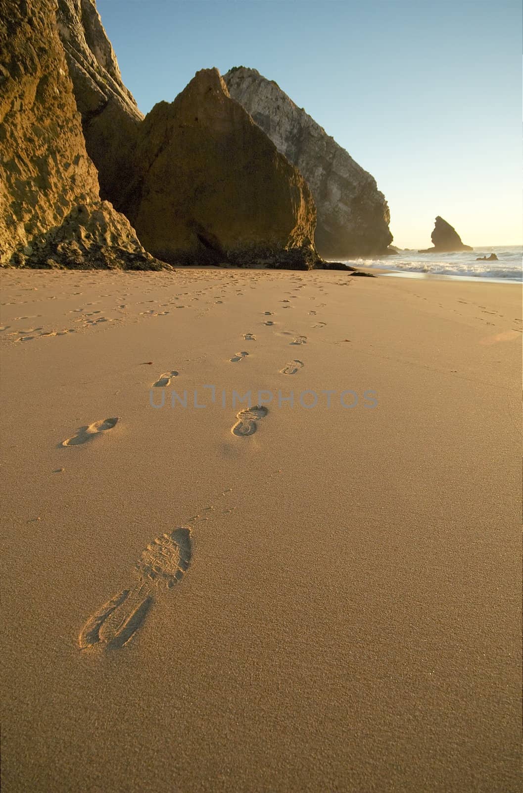 Footsteps at Adraga beach, near Sintra