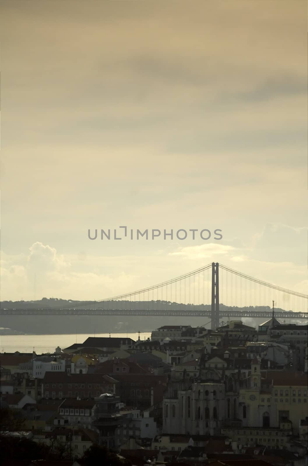 View of Lisbon's Chiado quarter with April 25th bridge on the background
