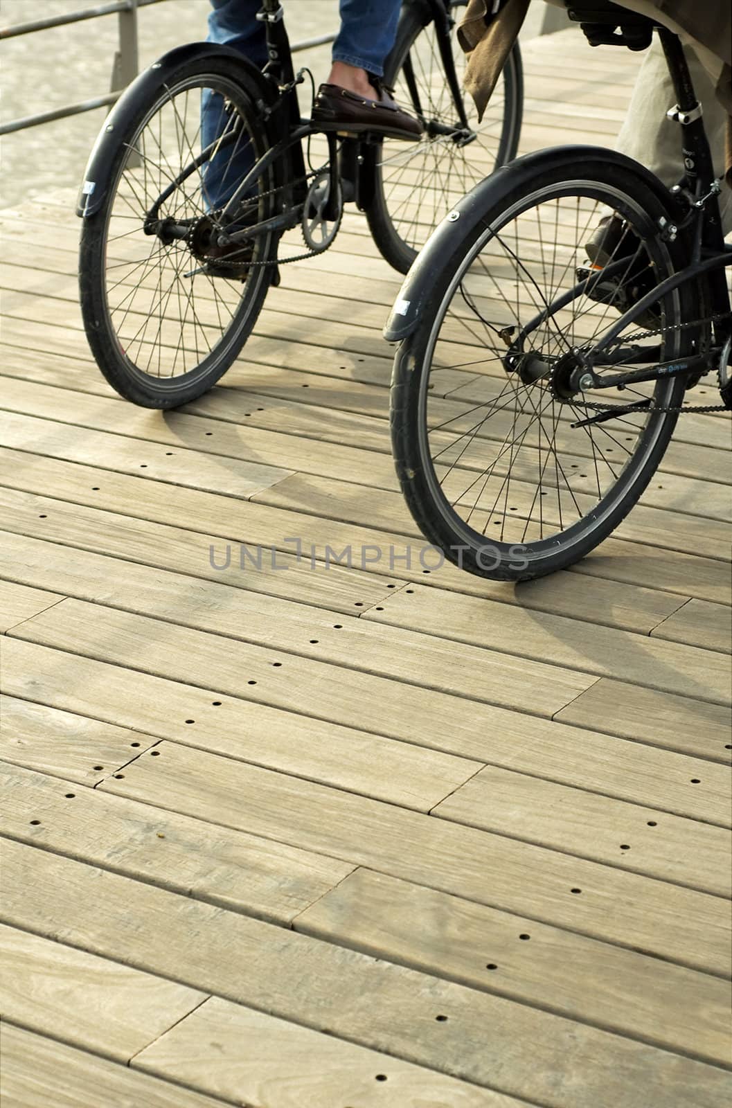 Detail of couple riding bicycle