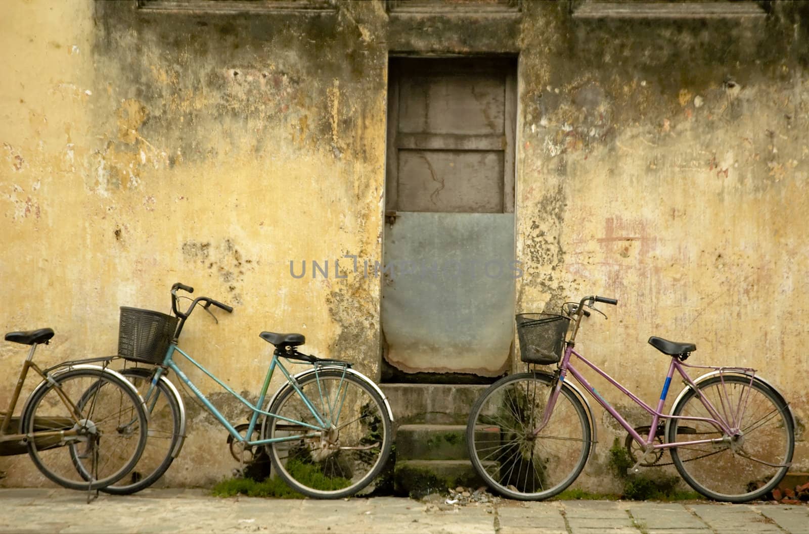 Parked bikes at at street of Hoi An