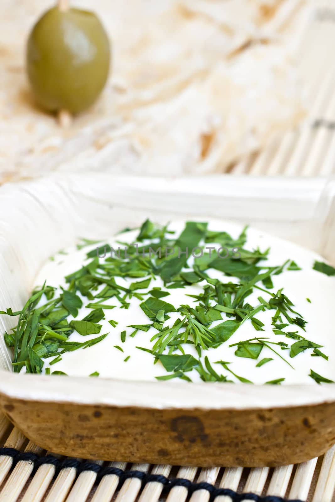 wheat bread with olive and dip.