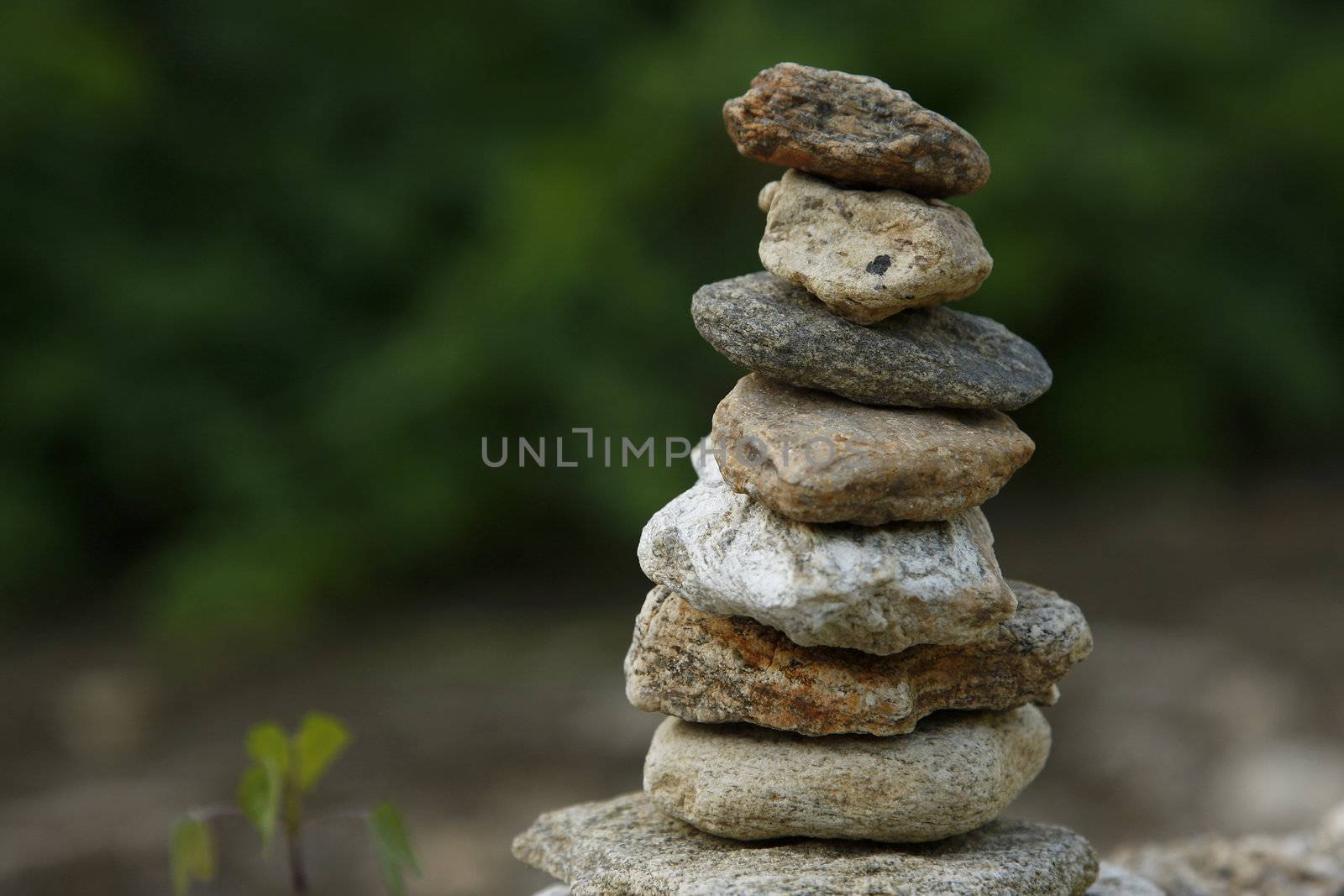 A zen-like picture of a stack of rocks with a blurred background