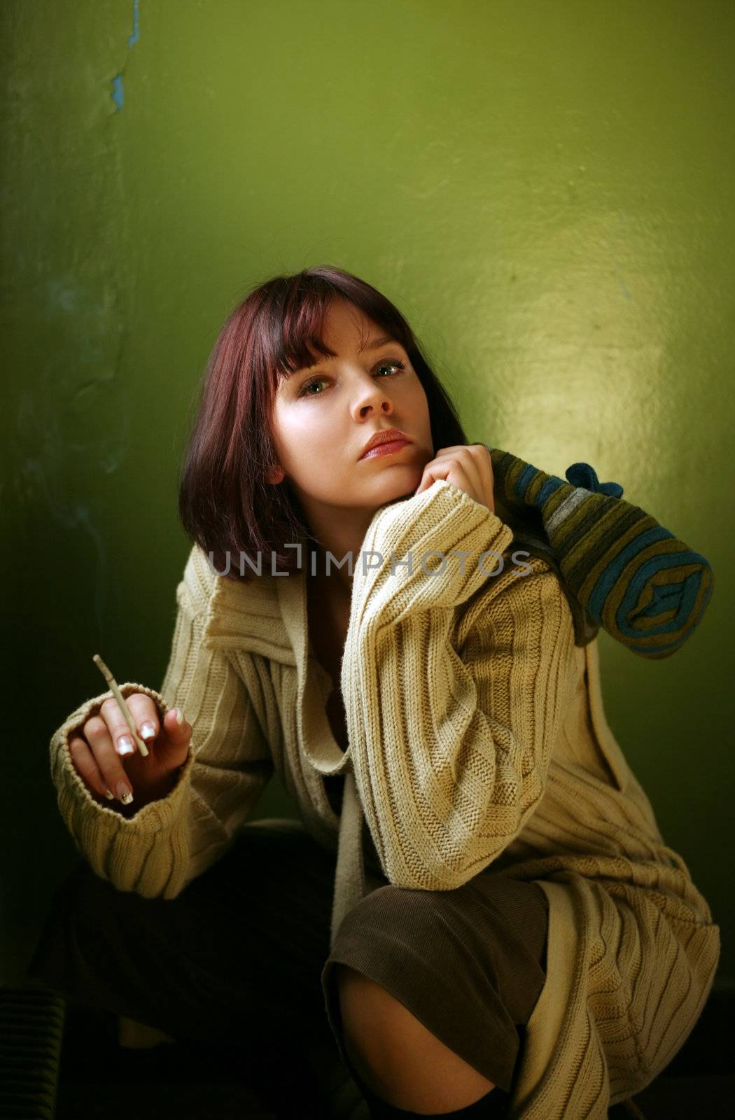 The beautiful brunette gets a light a cigarette