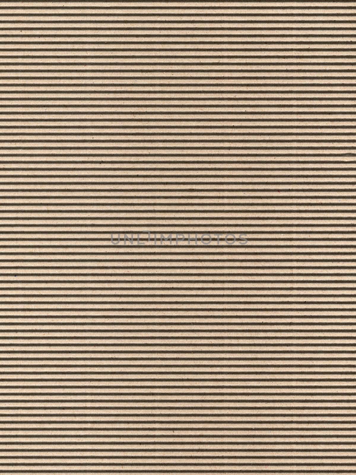 Seamless brown corrugated cardboard sheet useful as a background