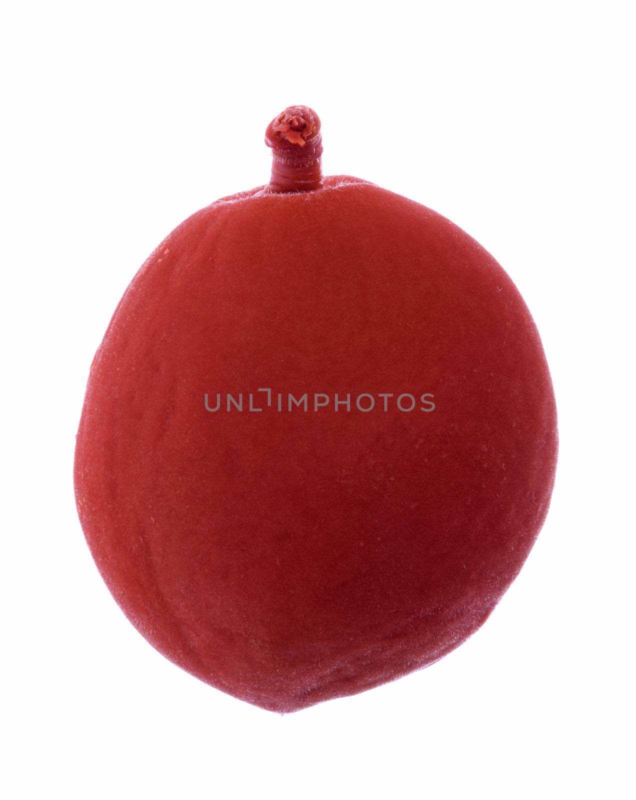 Isolated macro image of a preserved red plum.